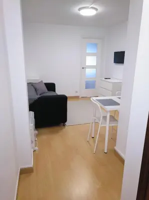 a living room with a couch and a table at Estudio. Sada, A Coruña. in Sada