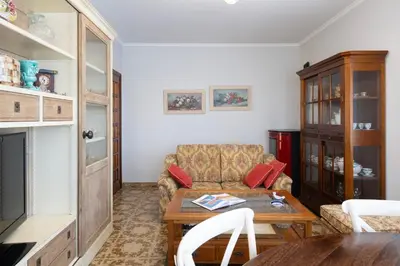a living room with a couch and a table at Casa Jesús in A Capela