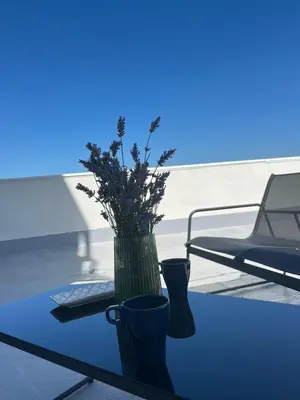 two vases sitting on a table with a keyboard at Apartamento a Carballeira in Lugo