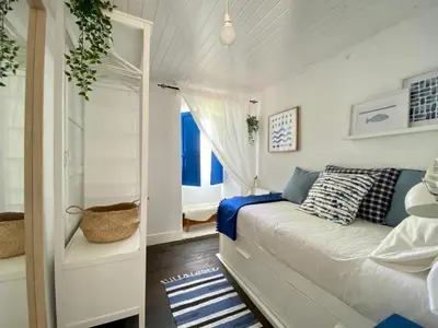 a small bedroom with a bed and a window at RIBEIRA SACRA La Imperfecta in Ferreira de Panton