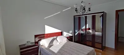 a bedroom with a bed and a large mirror at Casa Meri in El Espino
