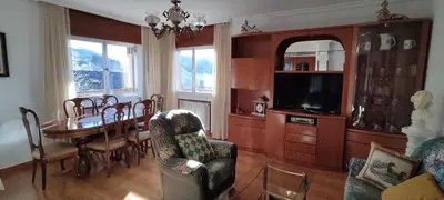a living room with a table and a dining room at Casa Meri in El Espino