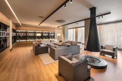 a living room with couches and a fireplace at Exe Peregrino in Santiago de Compostela