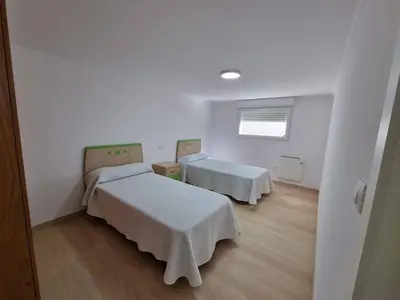 a hospital room with two beds and a window at Terrazas del Cantábrico in Foz