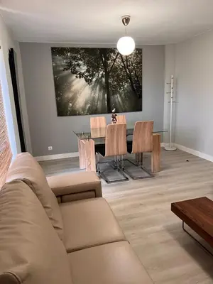 a living room with a couch and a table with chairs at Viveiro-Lugomar in Viveiro