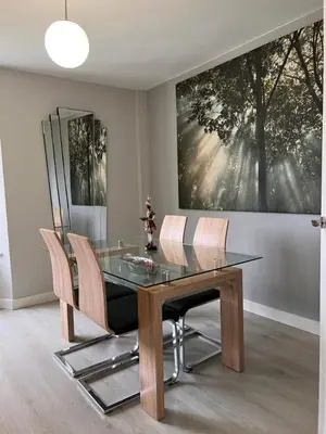 a dining room with a glass table and chairs at Viveiro-Lugomar in Viveiro