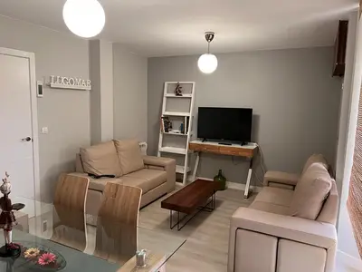 a living room with a couch and a tv at Viveiro-Lugomar in Viveiro