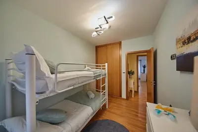 a room with two bunk beds and a hallway at Vut Salvador Santiago in Santiago de Compostela