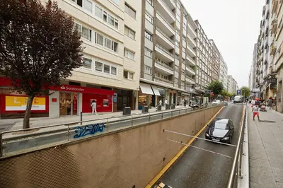 a car parked on the side of a city street at Vut Salvador Santiago in Santiago de Compostela