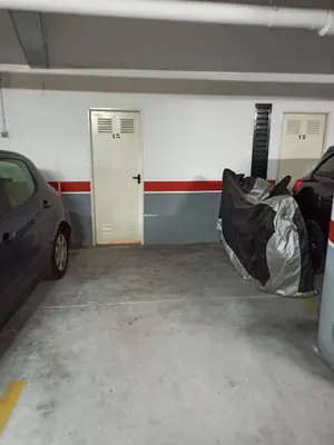 a garage with two cars parked in it at Indiano 1K in Viveiro
