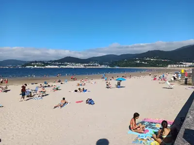 a group of people on a beach at Indiano 1K in Viveiro