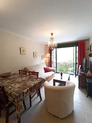 a living room with a couch and a table at Indiano 1K in Viveiro