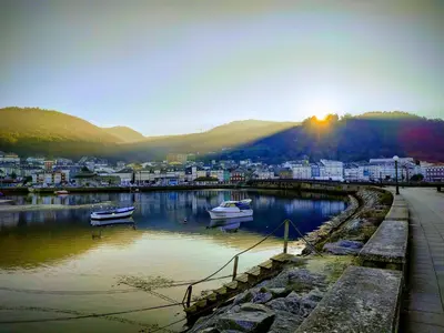 a city with boats in a body of water at Indiano 1K in Viveiro