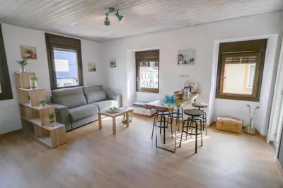 a living room with a couch and a table at O Lar do Camiñante in Palas de Rei
