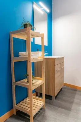 a bathroom with a wooden shelf and a sink at O Noso Recuncho in Palas de Rei