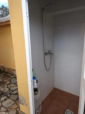 a bathroom with a shower stall with a shower at Casa Icaro in Barreiros