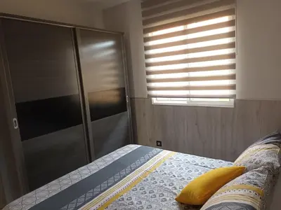 a bedroom with a bed and a glass shower at Casa Icaro in Barreiros