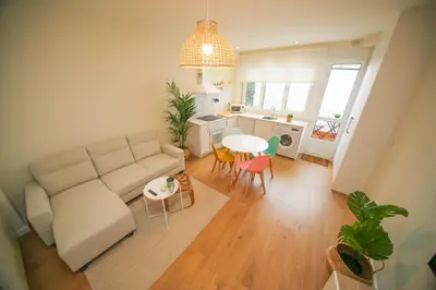 a living room with a couch and a table at Noreas Centro Lucus Augusti in Lugo