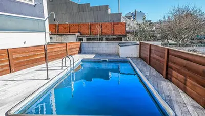 a swimming pool on the roof of a building at Alargos Foz in Foz