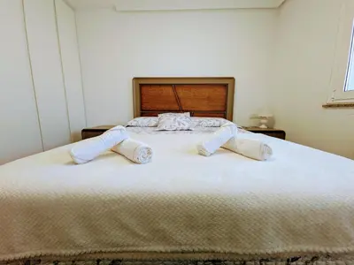 a bedroom with a bed with two pillows on it at Casa-Nova Centro in Sarria