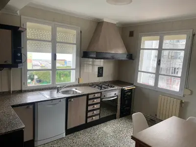 a kitchen with a sink and a stove at Apt Sueiras in Burela de Cabo