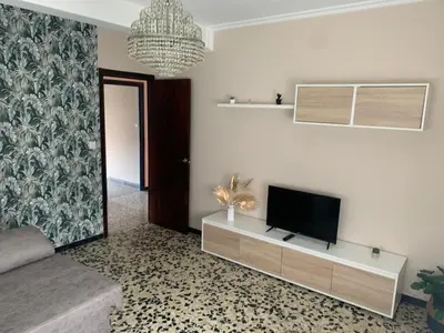 a living room with a flat screen tv on a wall at Apt Sueiras in Burela de Cabo