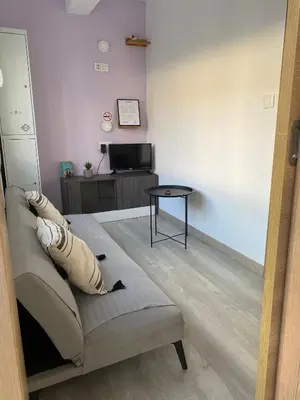 a living room with a couch and a table at ApartmentoTerra de Augas 1 in Caldas de Reis