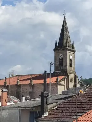 a church with a clock tower on top of a building at ApartmentoTerra de Augas 1 in Caldas de Reis
