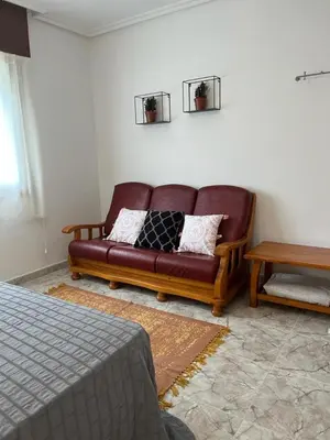 a living room with a couch and a table at Casa Las Piedras in Padrenda