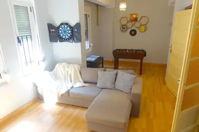 a living room with a couch and a table at Yellow Door 2 in Ponferrada