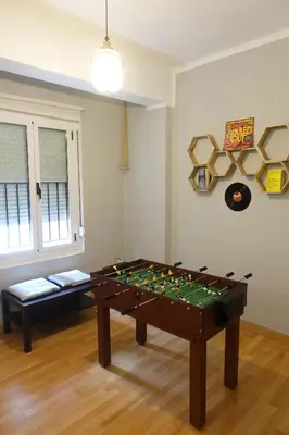 a living room with a table and a couch at Yellow Door 2 in Ponferrada