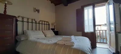 a bedroom with a bed with towels on it at Casa de Abril 2 in San Cristóbal de Valdueza