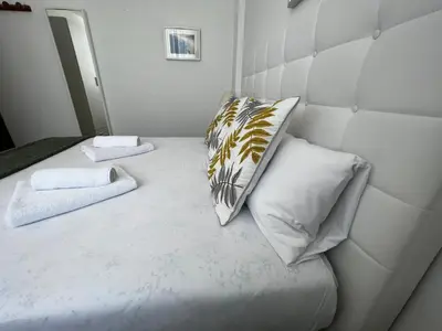 a bedroom with a bed with two pillows on it at Oktheway Perbes Vintage 2 in Perbes
