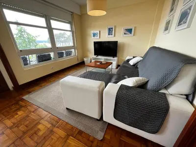 a living room with a couch and a television at Oktheway Perbes Vintage 2 in Perbes