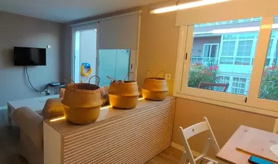 a living room with three baskets on a table at LOFT CON TERRAZA en el centro de Santiago de Compostela VUTCO 07320 in Santiago de Compostela