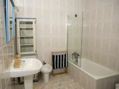 a bathroom with a sink and a toilet and a shower at A Casiña - Casa Rural en la Ribeira Sacra, Galicia in Ourense