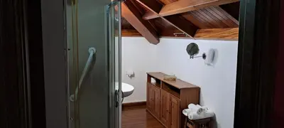 a bathroom with a shower and a toilet and a sink at Casa Buda Conors & Spa Boutique in Foz
