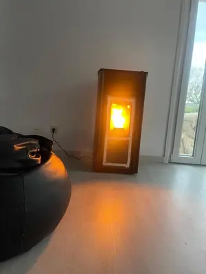 a lantern with a light in a room with a floor at LA RATONERA in Podentes
