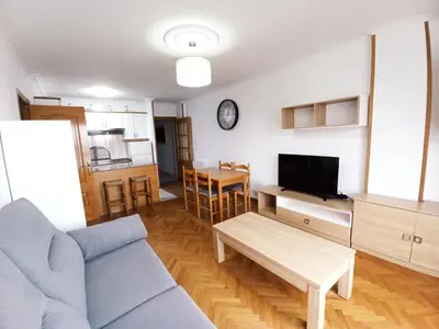 a living room with a couch and a table at Ría de Viveiro in Vivero