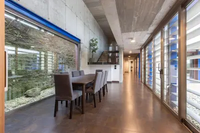 a dining room with a table and chairs at A Casa do Souto, Santiago de Compostela in Sigüeiro