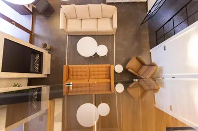 a living room with a couch and a television at A Casa do Souto, Santiago de Compostela in Sigüeiro
