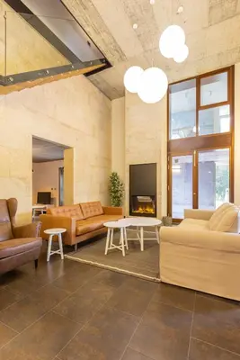 a living room with couches and a fireplace at A Casa do Souto, Santiago de Compostela in Sigüeiro