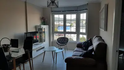 a living room with a couch and a table at Vial Sol in Viveiro