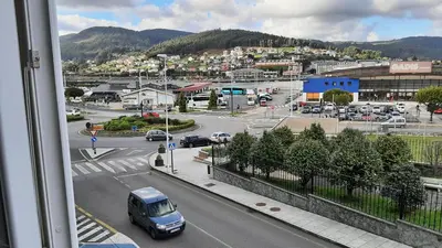 a view from a window of a city with a parking lot at Vial Sol in Viveiro