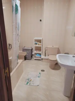 a bathroom with a sink and a toilet and a shower at PIso de 3 habitaciones en centro de Miño in Miño