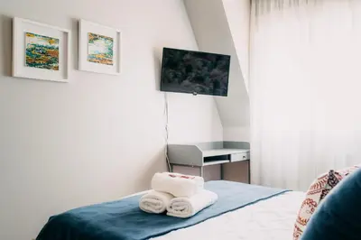 a room with a bed with towels on it at PENSIÓN CALDEA in Caldas de Reis