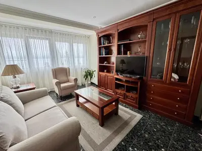 a living room with a couch and a coffee table at Apartamento A Tenencia in Sada