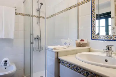 a bedroom with two beds with white sheets at CASA PAZOS-ARBO in Arbo