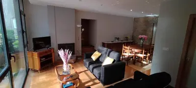 a living room with a couch and a dining room at Casa do Corredor in Chantada