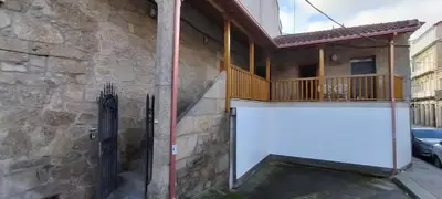 a external view of a house with a garage at Casa do Corredor in Chantada